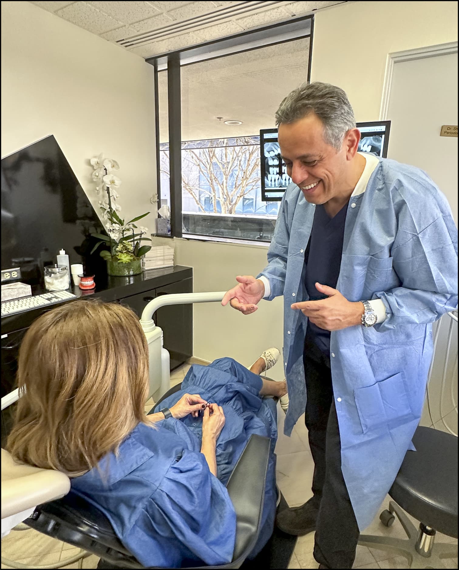 Dr. Baradaran with a patient at his Beverly Hills practice